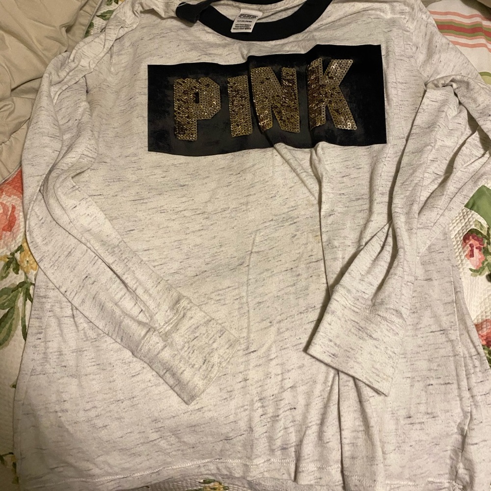 Small long sleeve shirt.